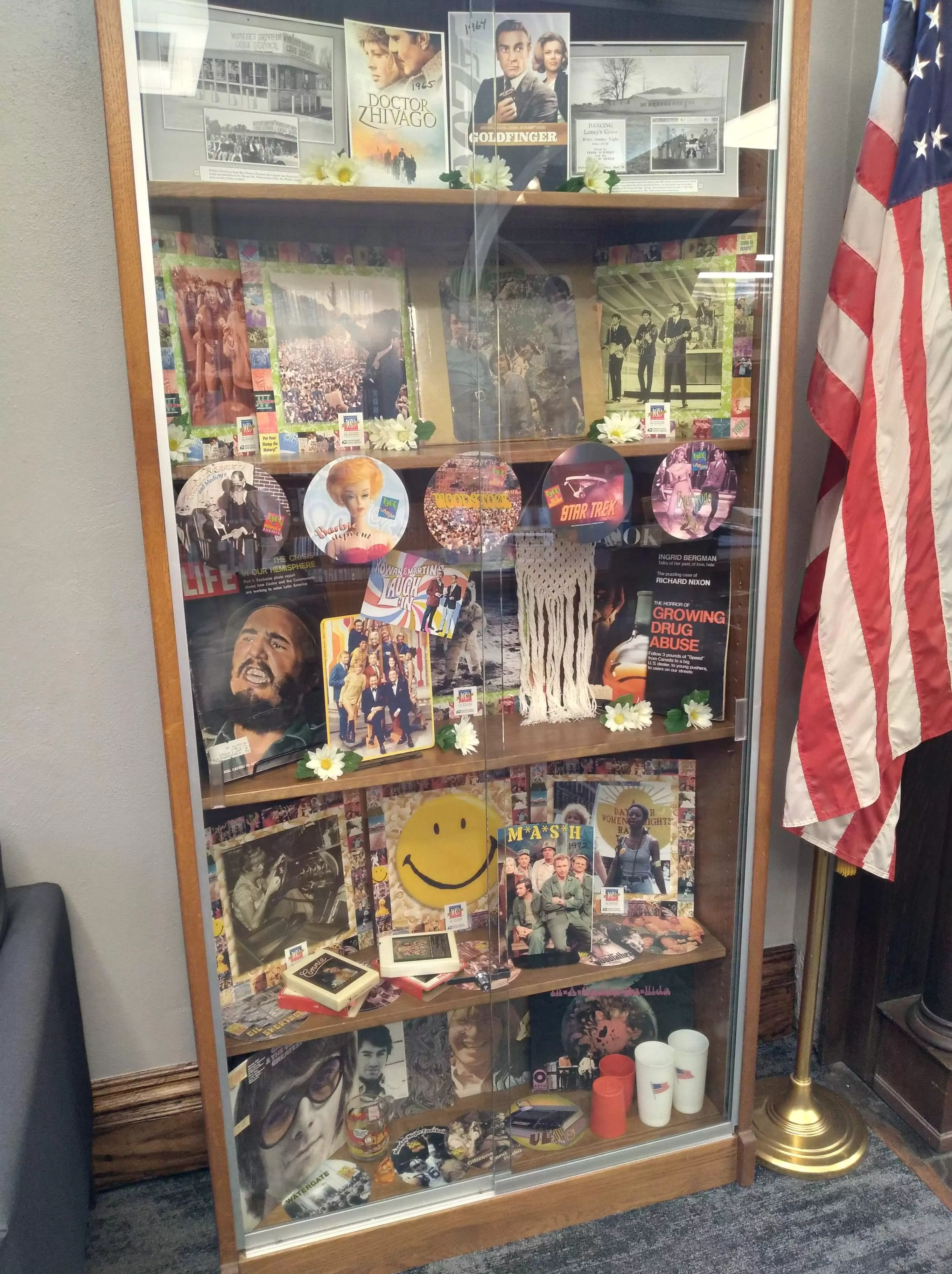 display case with 1960s items