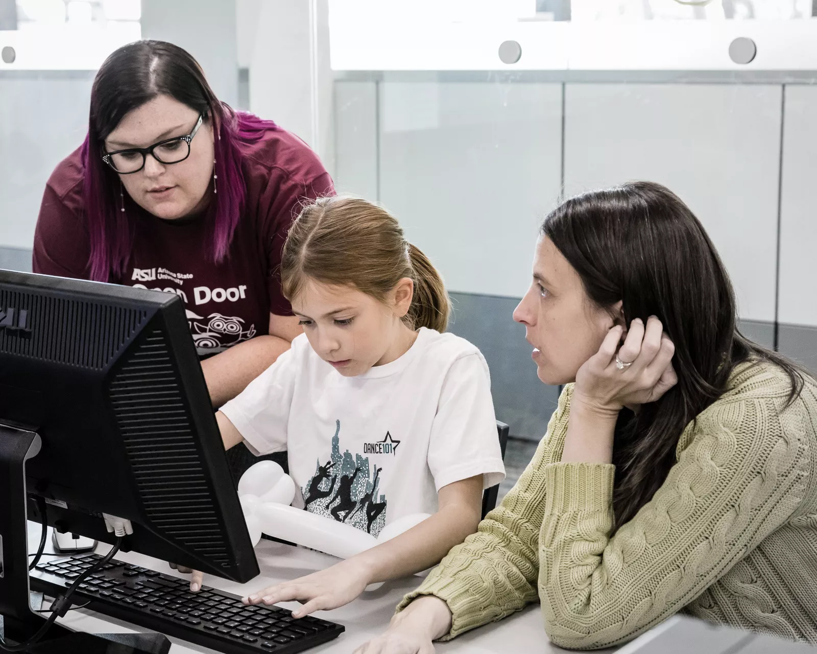 people in front of a computer