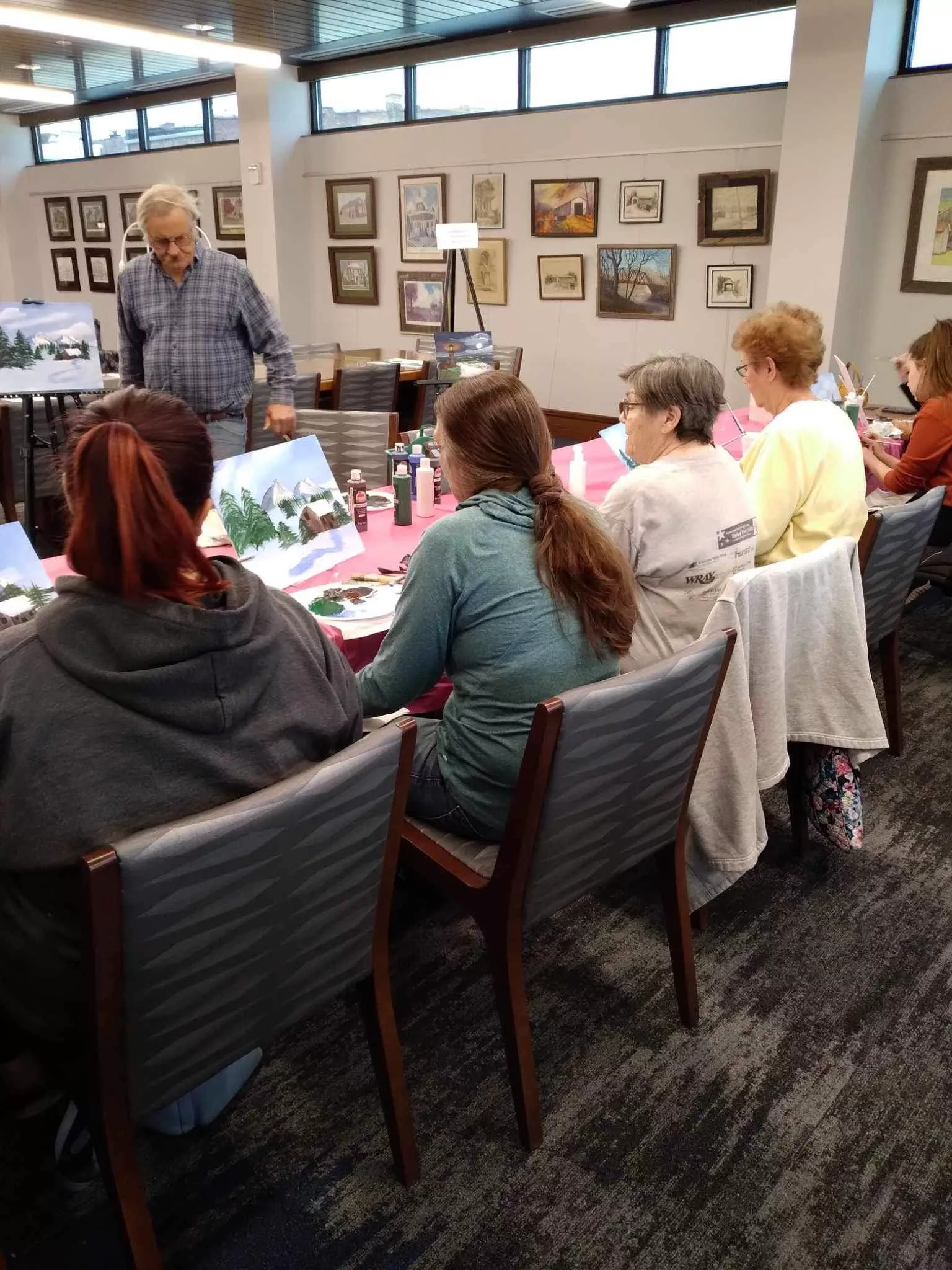 amateur painters receiving instructions