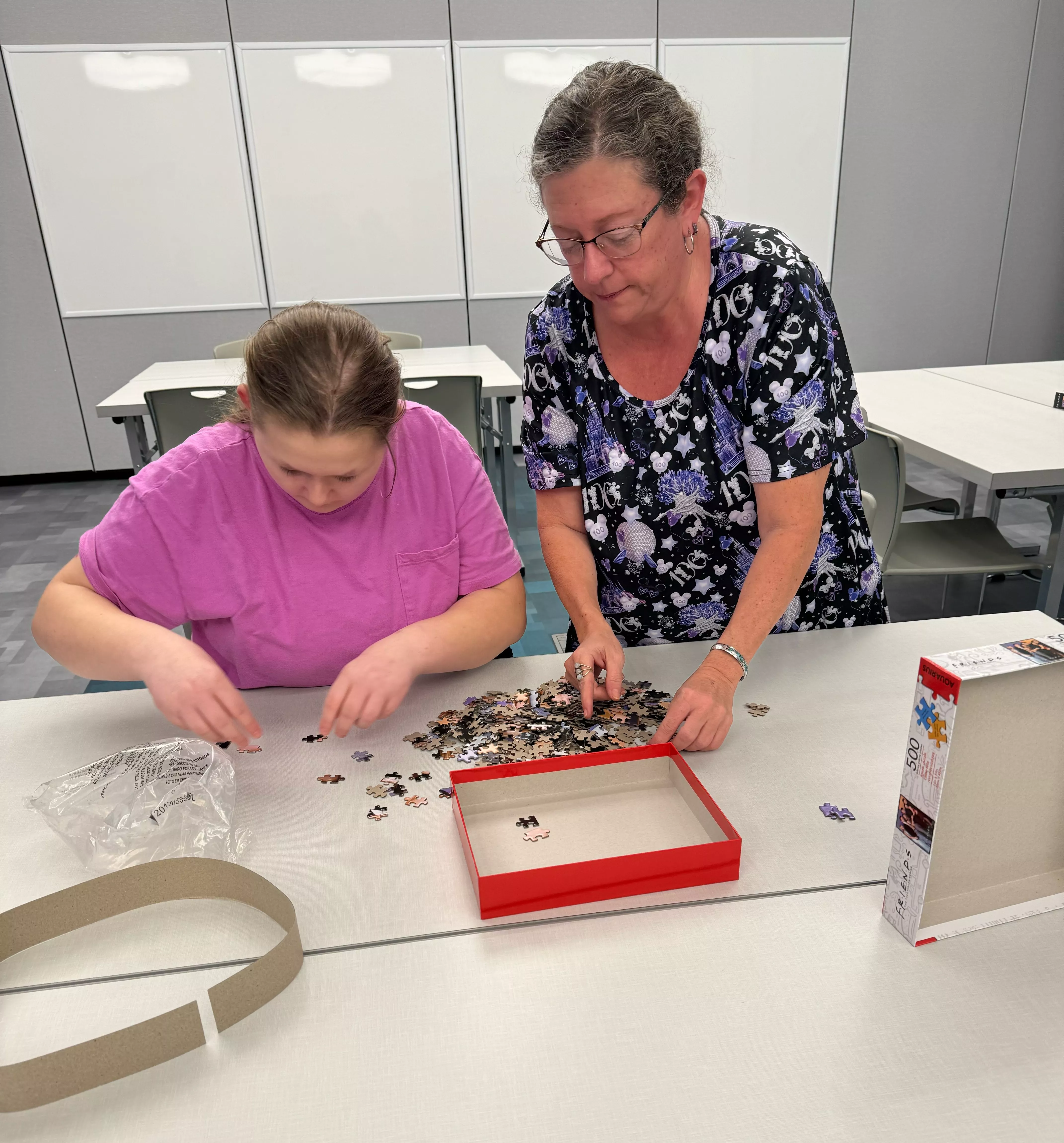 teen and woman with puzzle