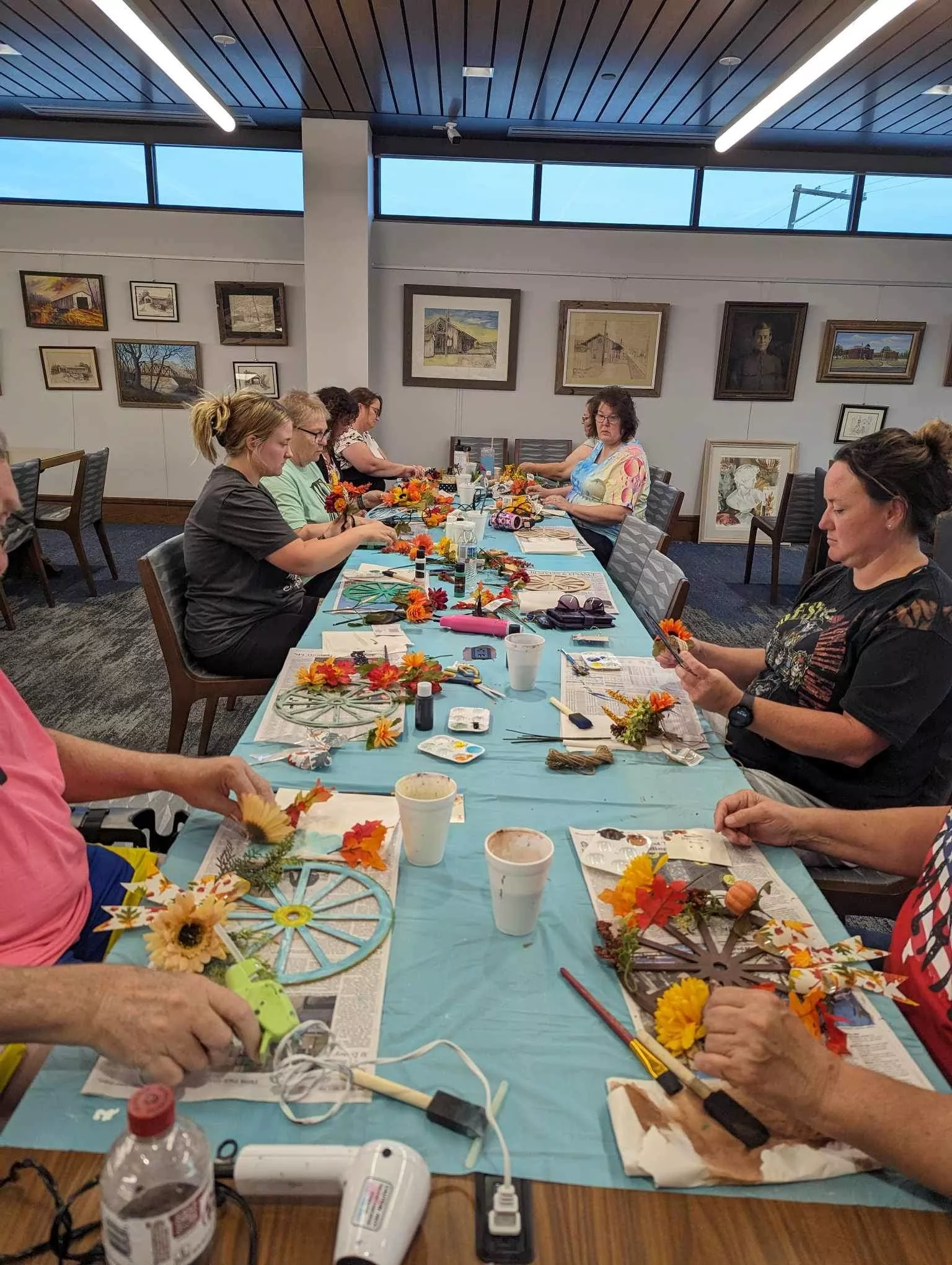 several people making wagon wheel crafts