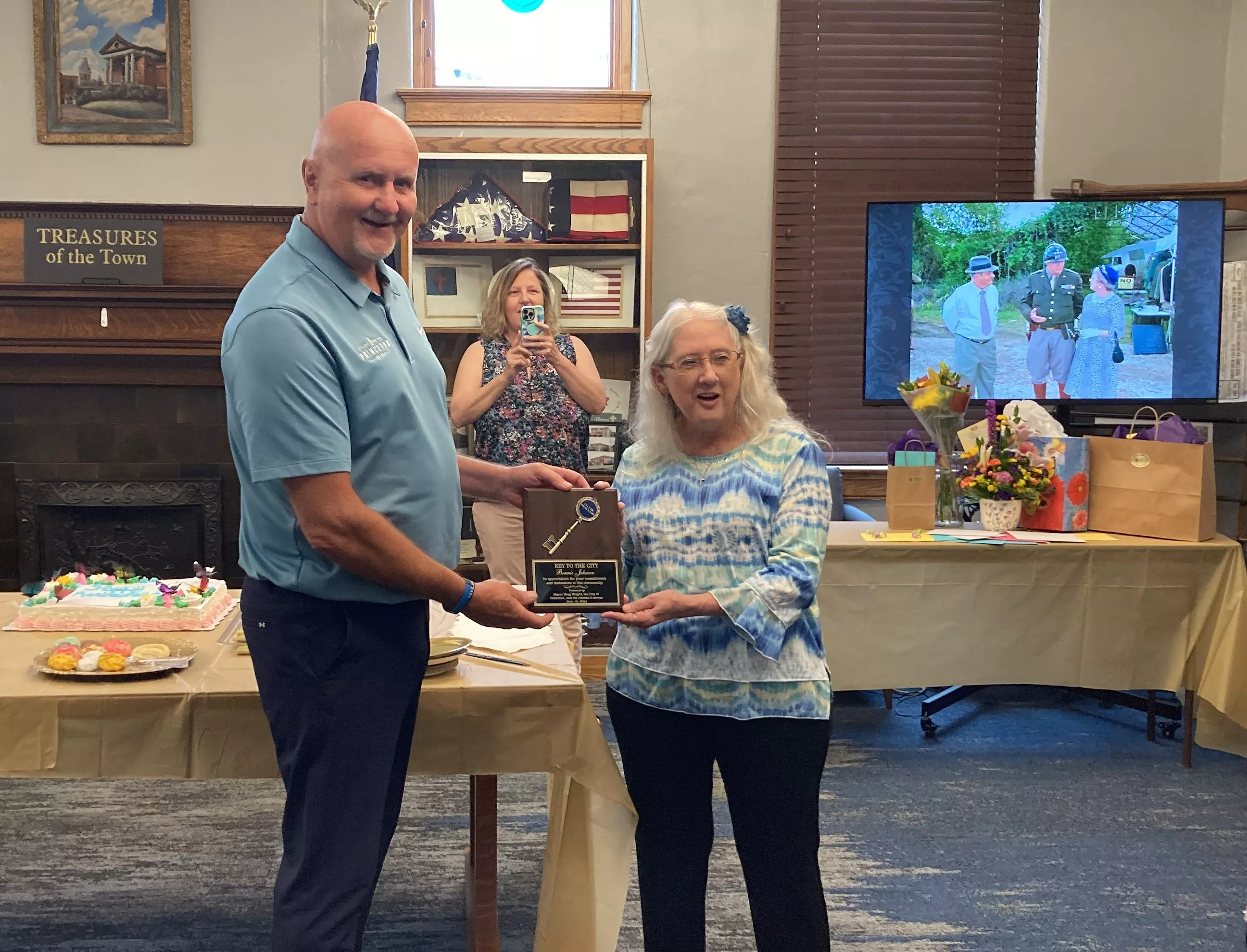 Princeton City Mayor Greg Wright awards Bonita Johnson with a Key to the City Award for her efforts as a decades long historian for Princeton Public Library and all of Gibson County