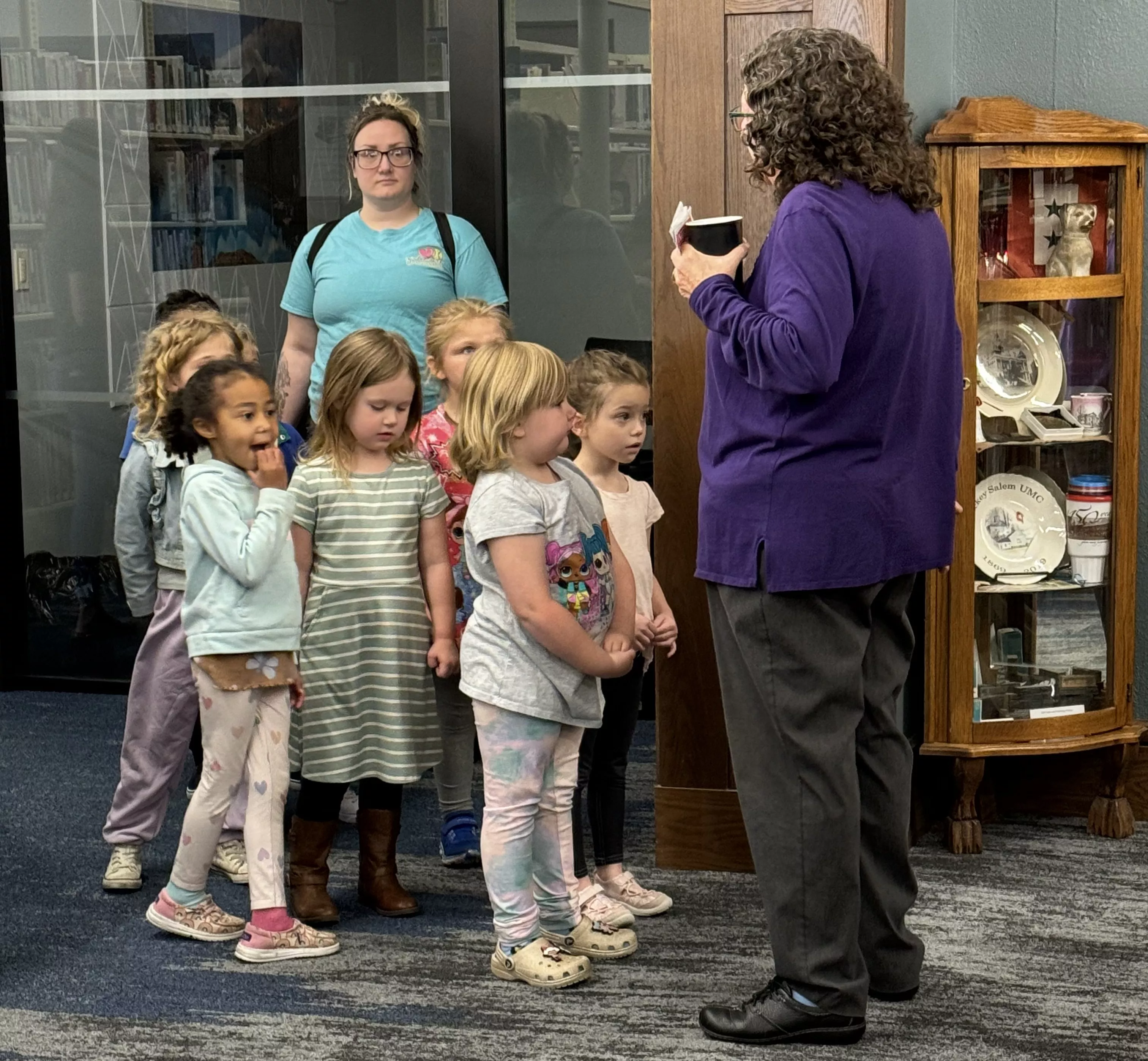 April Yockey gives preschool children&#039;s group a tour of the library in hopes to engage them with reading and library services once they become of age